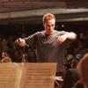 Christopher Stark conducts the Multi-Story Orchestra