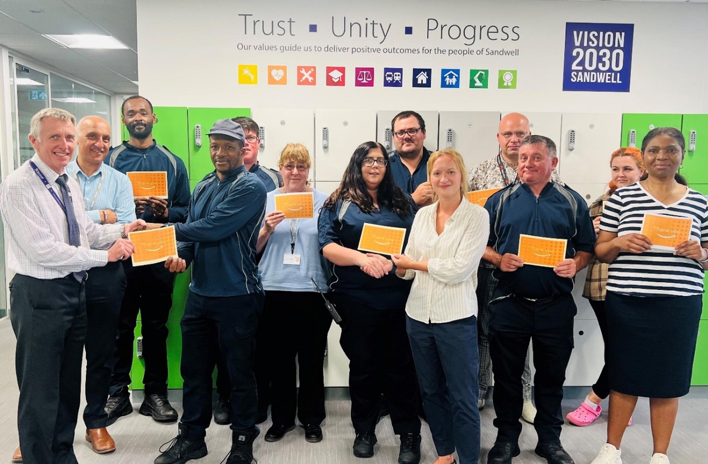 Robin Weare, assistant director, highway services, Sandwell Metropolitan Borough Council and Melissa Holmes, APCOA Midlands and North regional manager, presented vouchers to the team