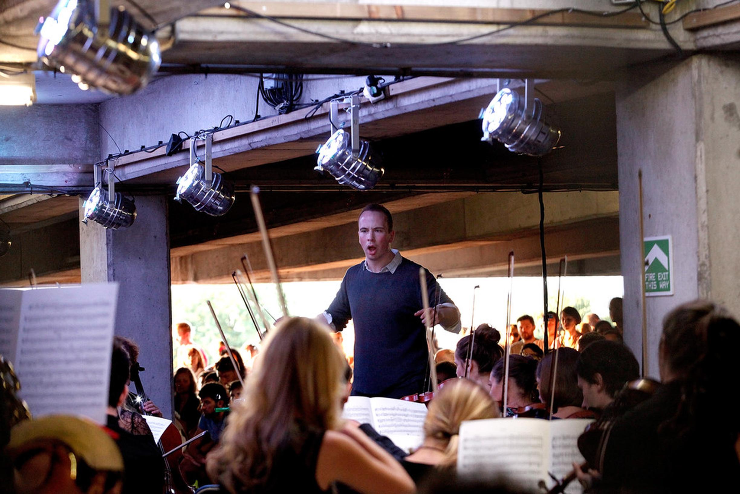 Christopher Stark conducting the Multi-Story Orchestra