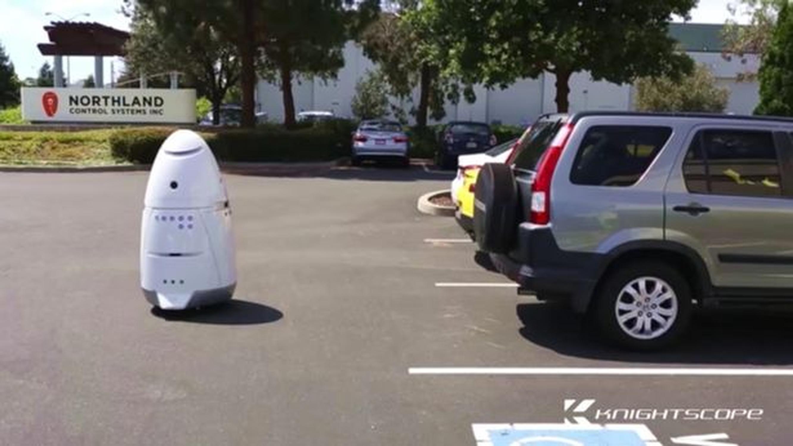 A Knightscope K2 robot patrolling a car park