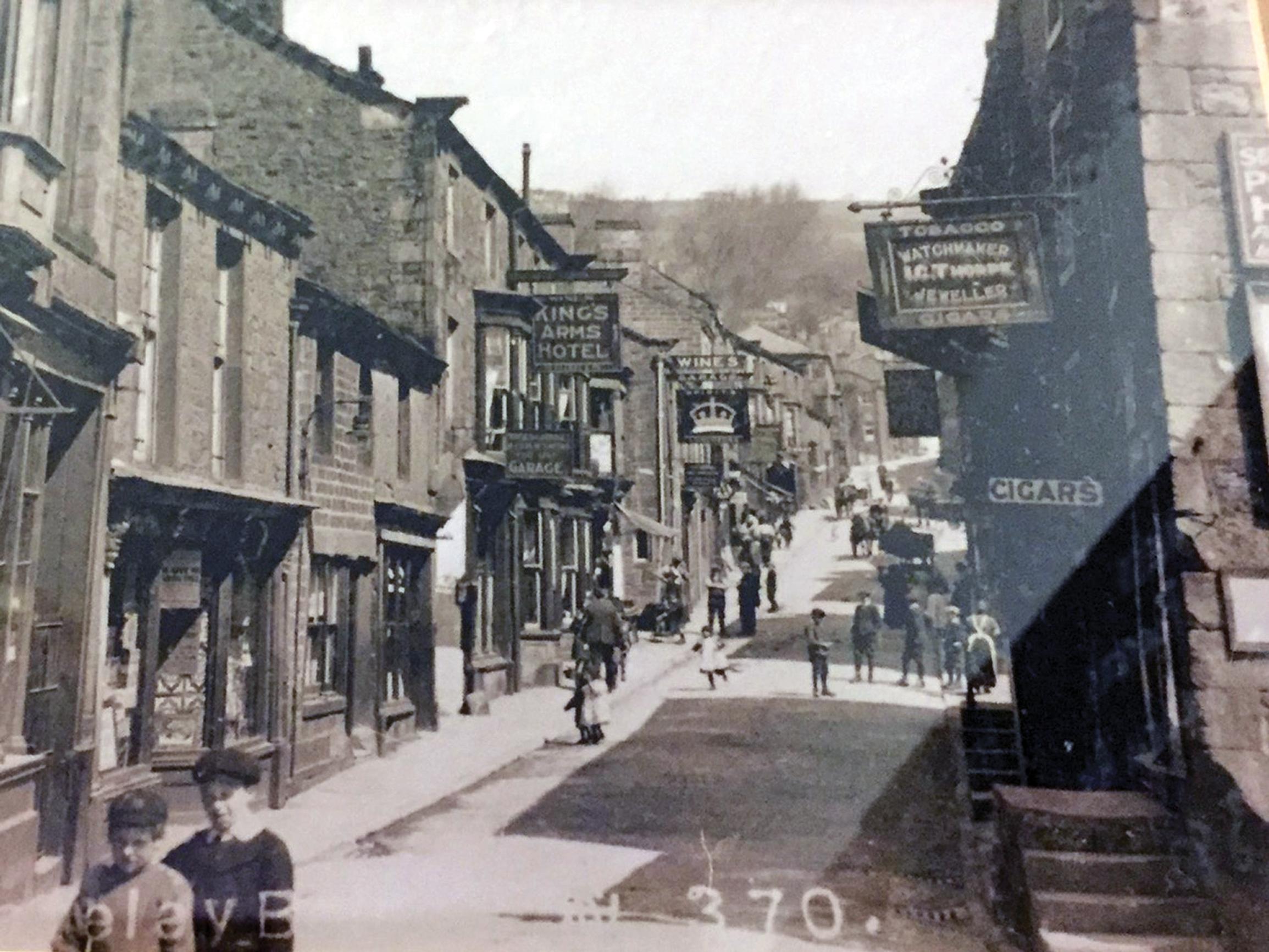 This 1910 photo, hanging in The Crown, shows that the footways were narrow before the motor era