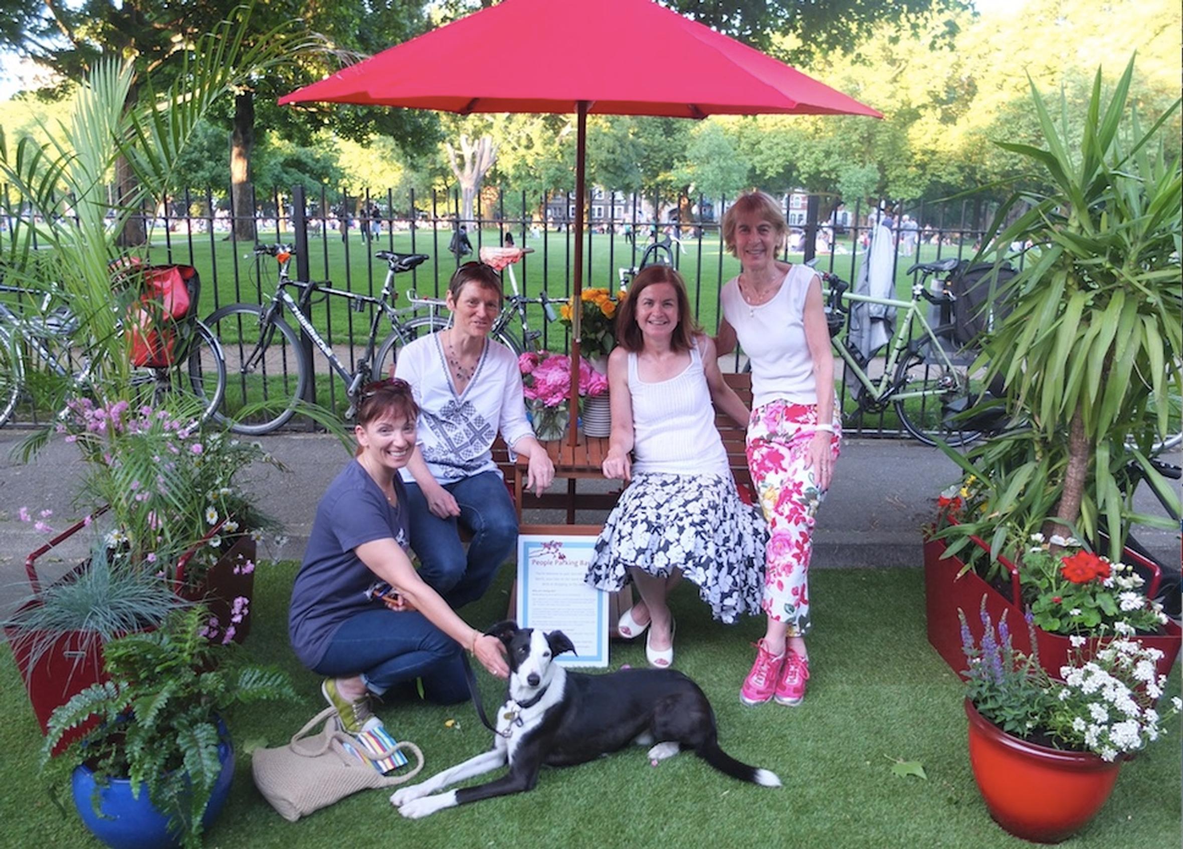 Brenda Puech (second from right) with friends on the reclaimed parking bay outside her home in Hackney