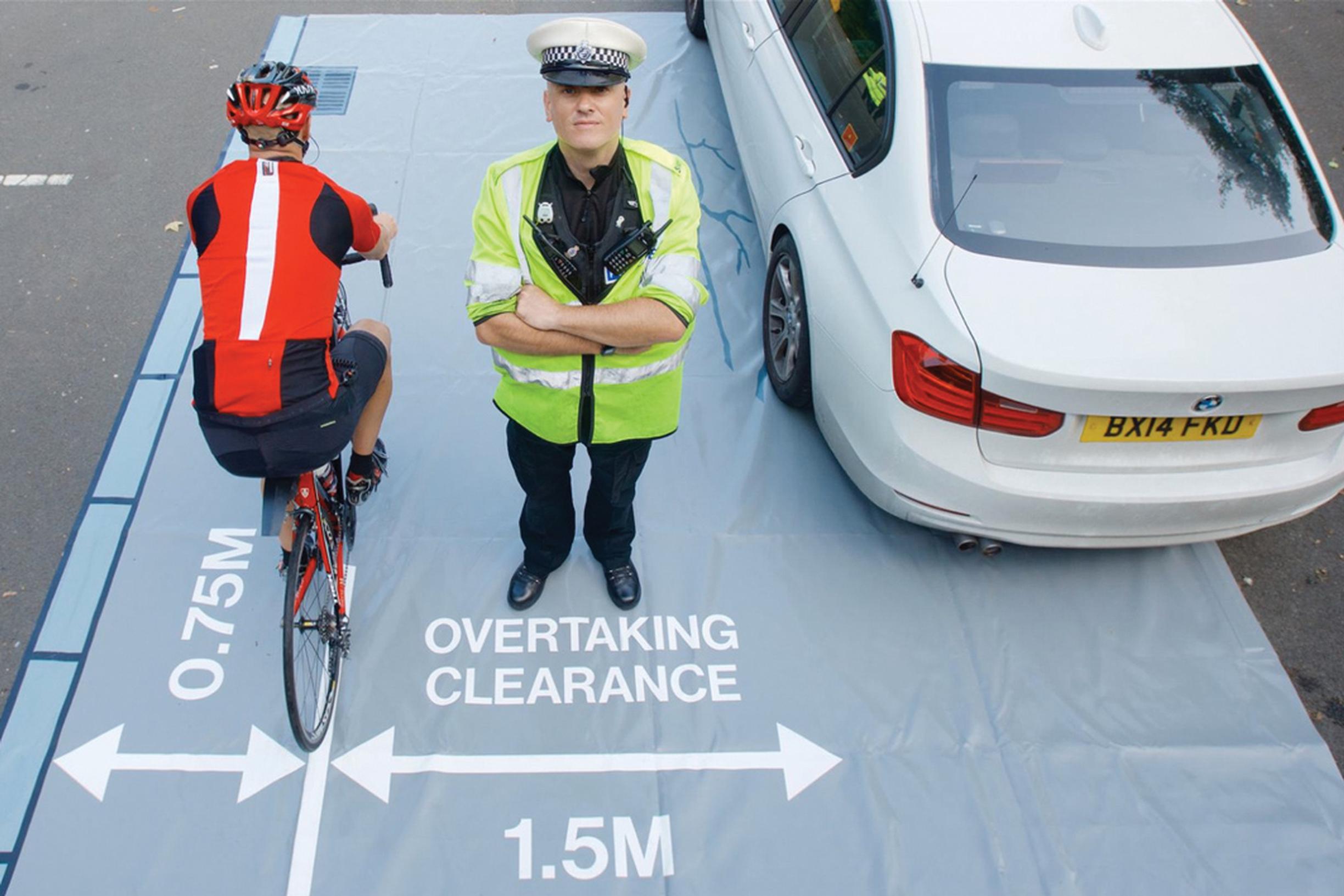 The police use mats to illustrate safe passing distances to drivers