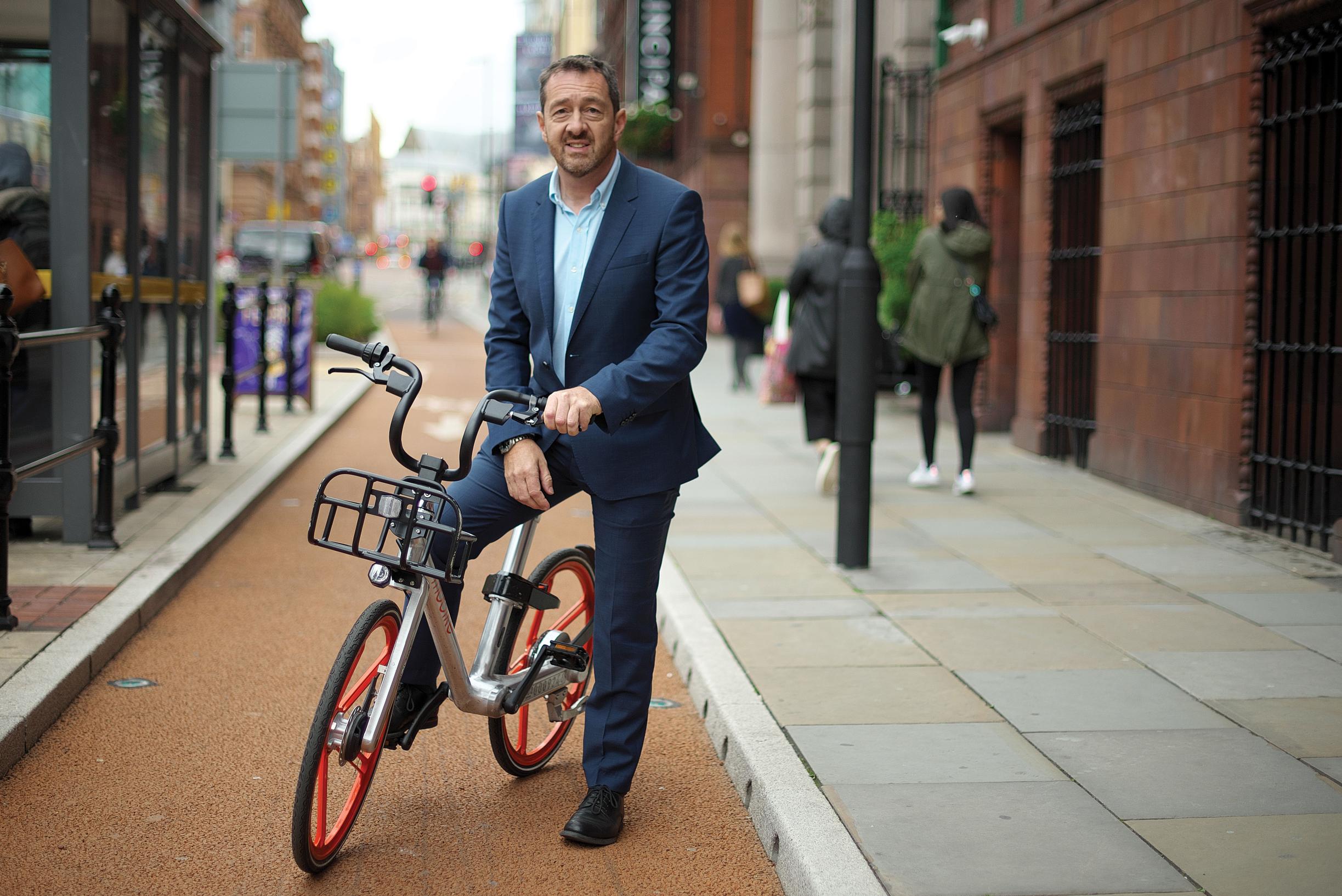 Chris Boardman on a bike-share Mobike on one of the region`s quiet cycleways