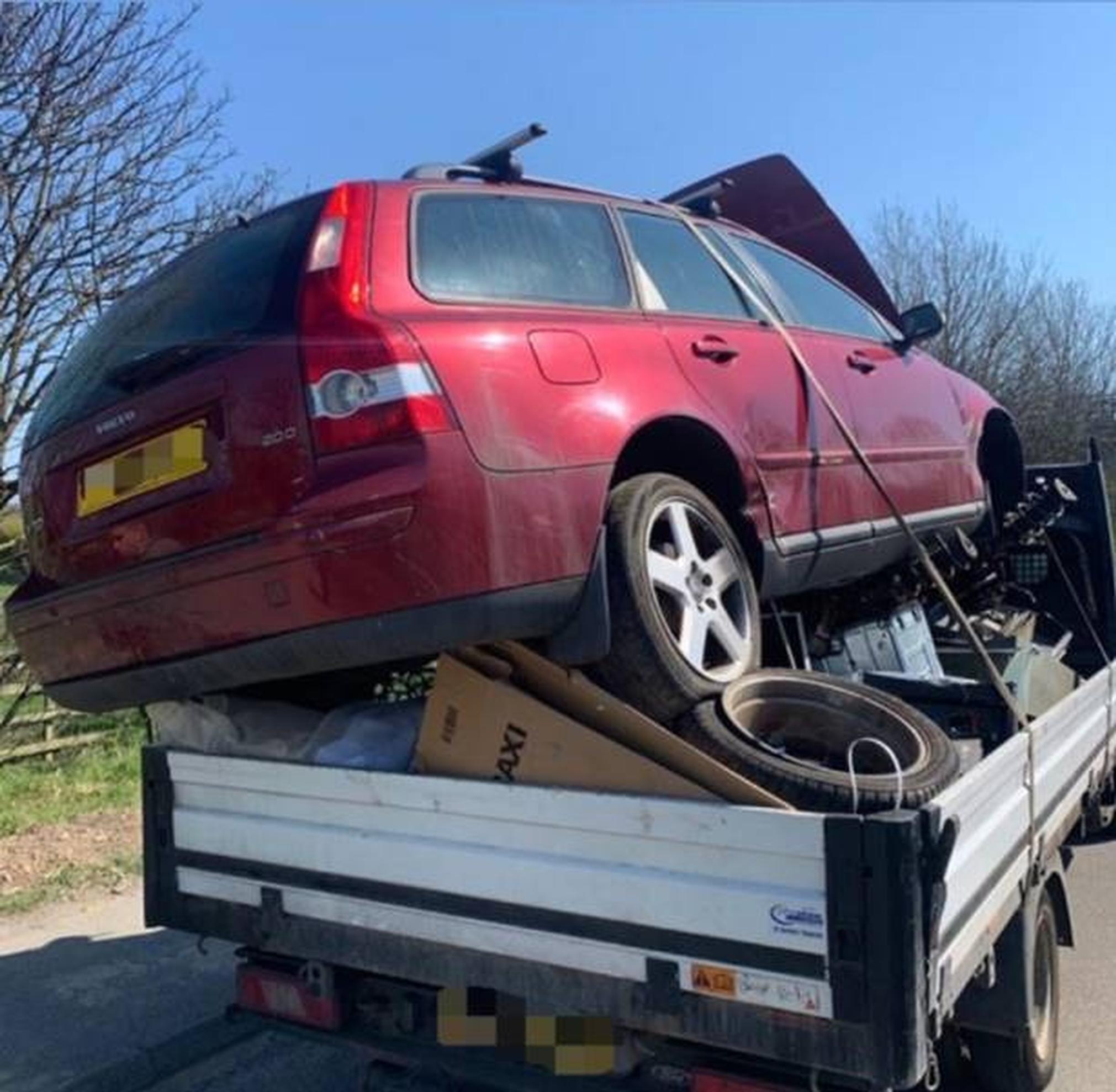A car precariously balanced on the back of a scrap van was found by Northumbria Police during Operation Brigantia