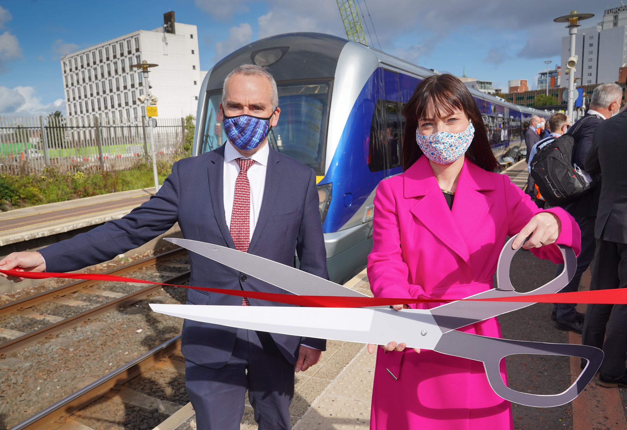 Translink group chief executive Chris Conway with infrastructure minister Nichola Mallon launching the first six-car Class 4000 train