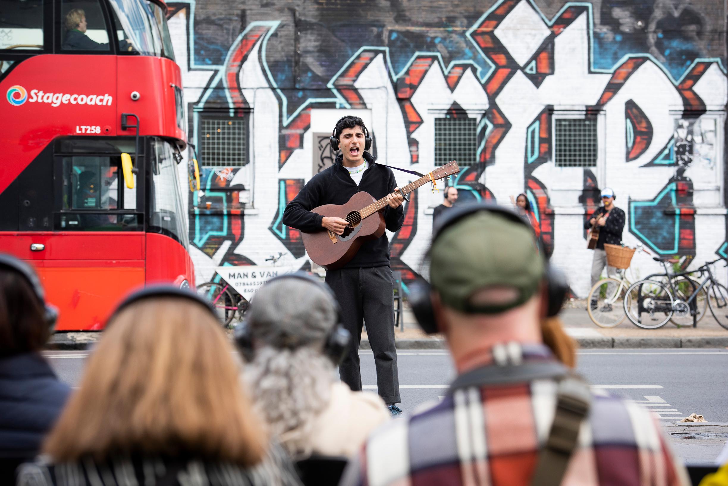 Musicians performed on a noisy street in Shoreditch, London