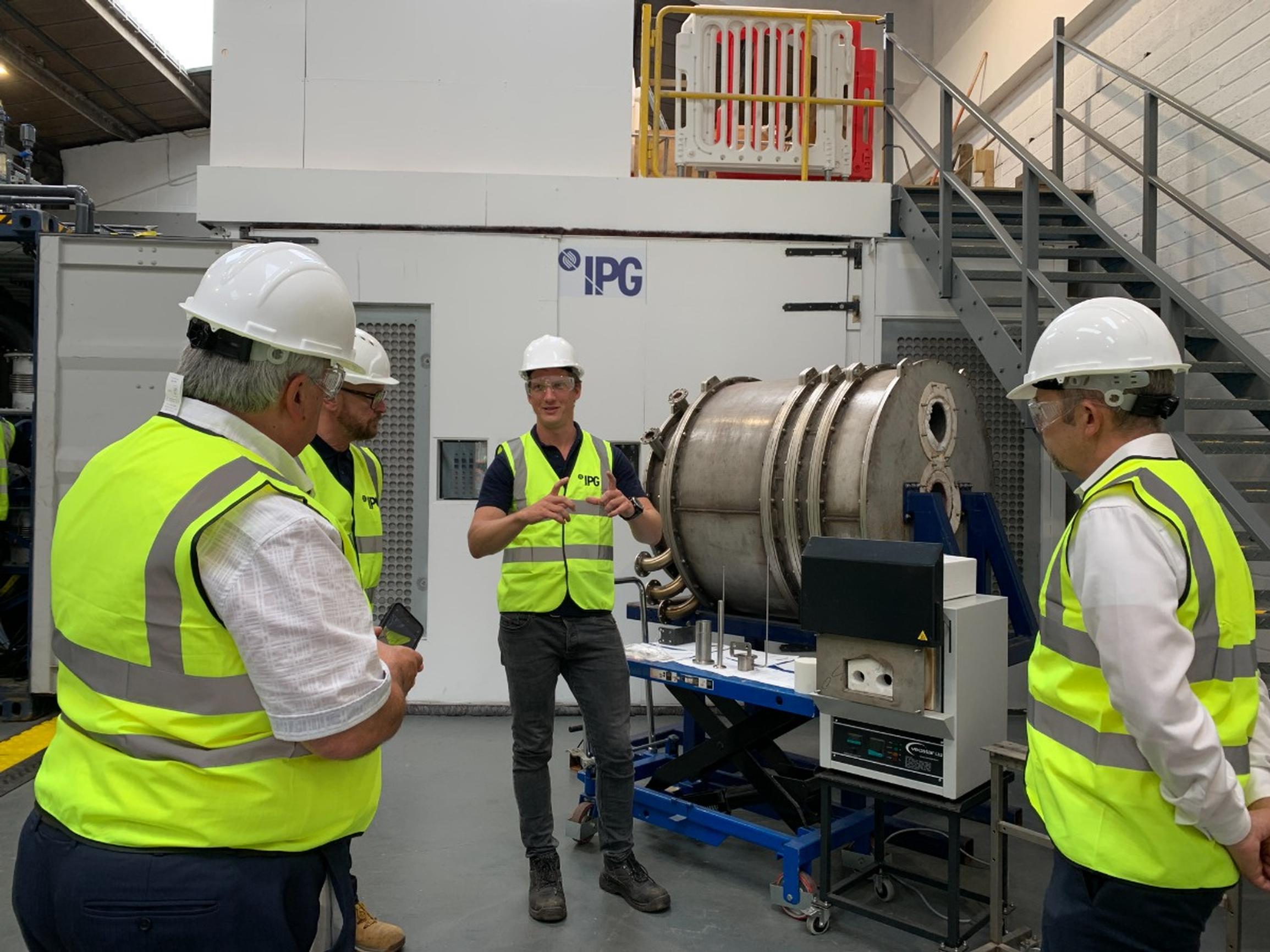 Brett Moolenschot, senior product manager for IPG demonstrates to flameless combustion system to National Highways team