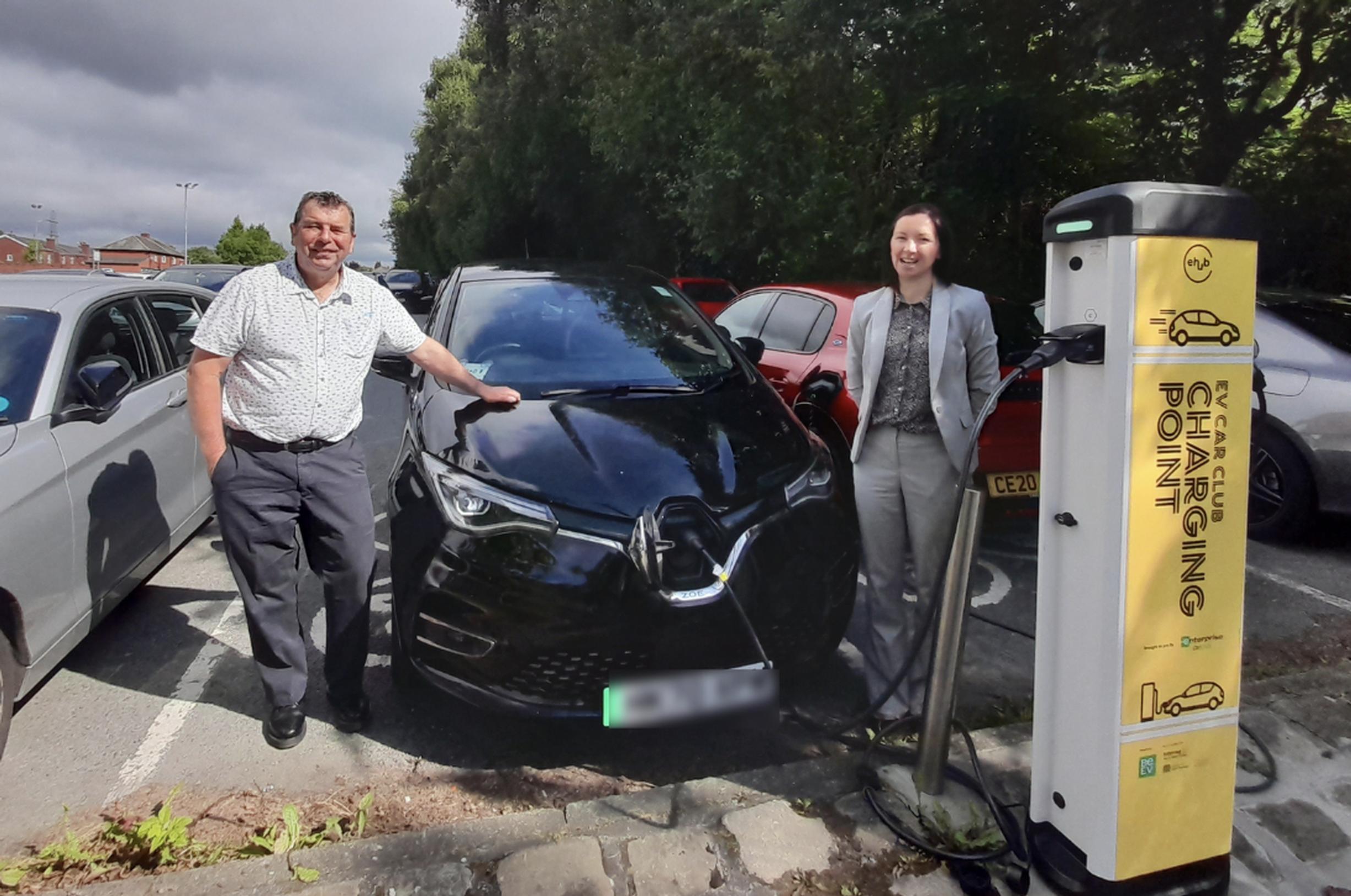 Cllr Alan Quinn and Candice Turner from Enterprise Car Club with the electric hire cars at Fairfax Road, Prestwich