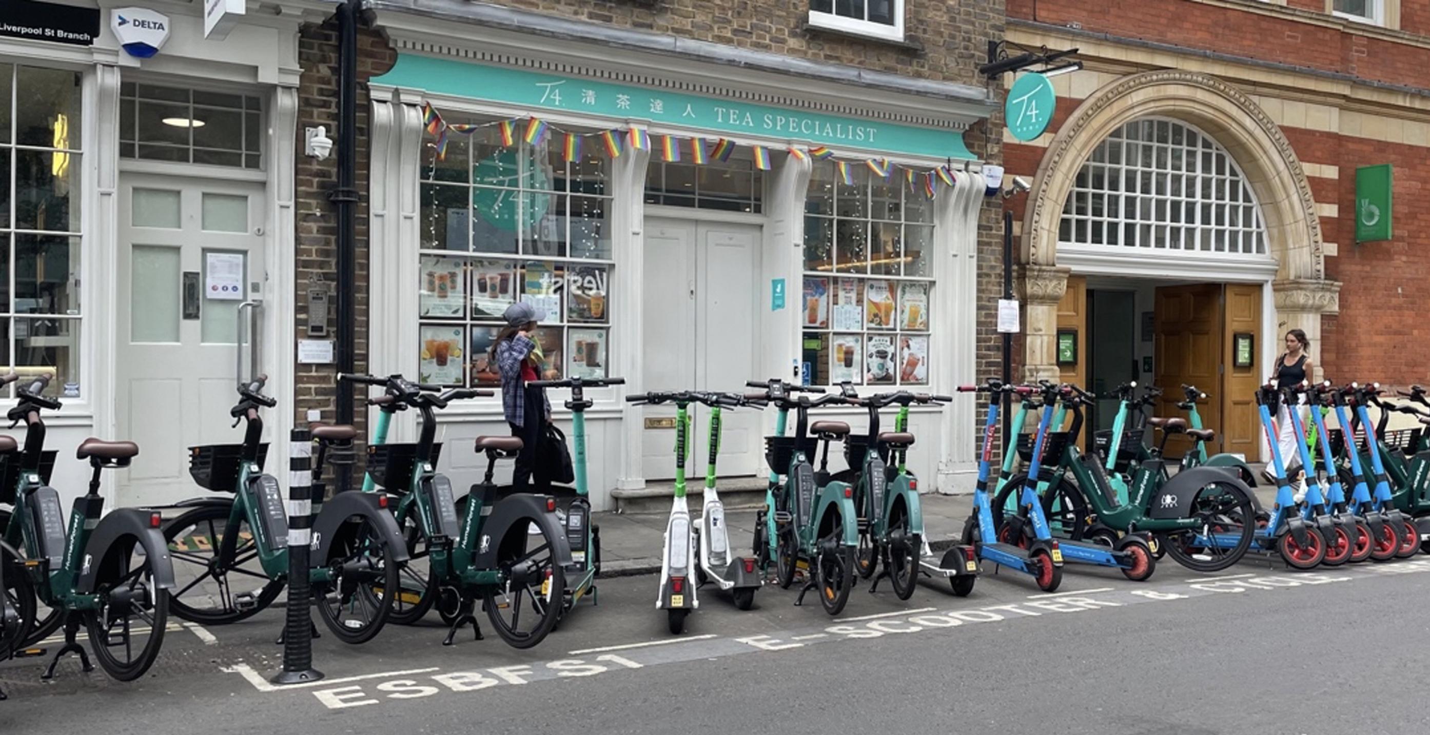 Shared e-bikes and e-scooters competing for space, London July 2022