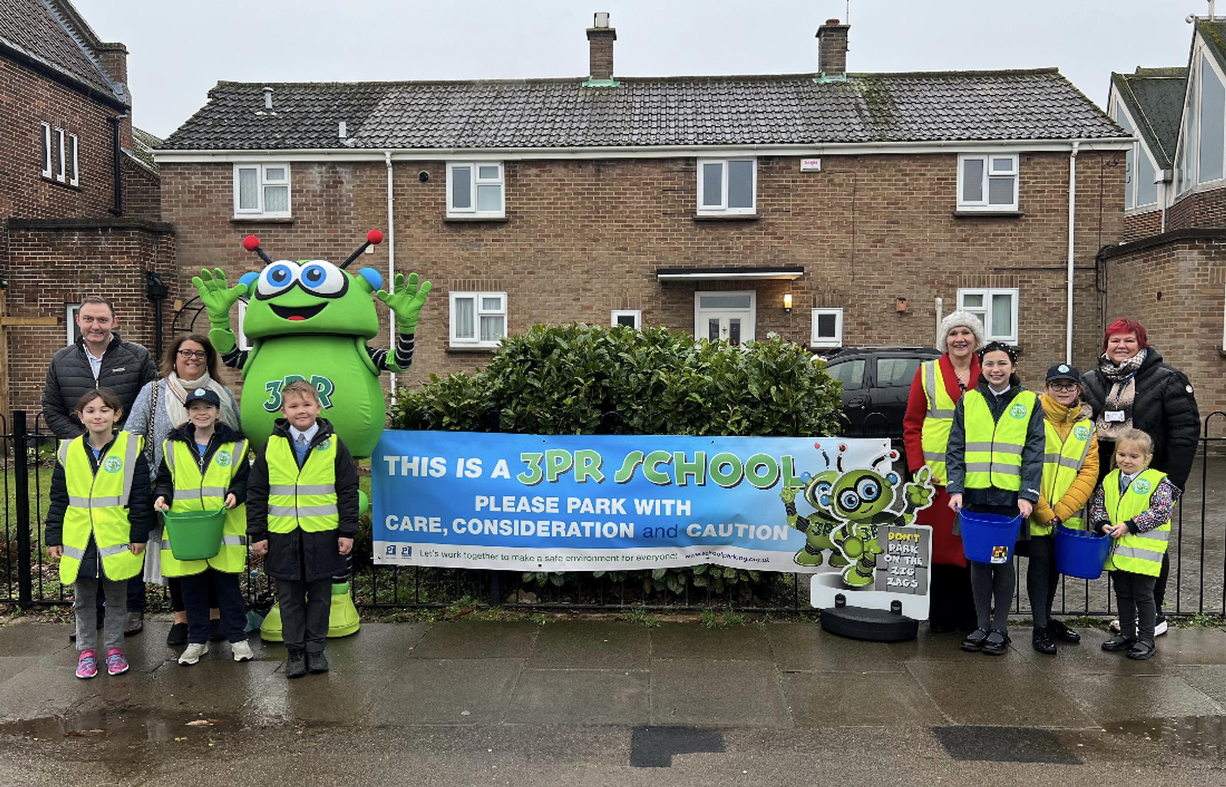 3PR launch at St Teresa’s Catholic Primary School in Colchester on 10 January (Not in order): Cllr Martin Goss (NEPP’s member for Colchester City Council), ward councillors Sue Lissimore and Leigh Tate, Mrs Kelly (headteacher of St Teresa’s Catholic Primary School), school pupils, and the 3PR costumed character (NEPP)