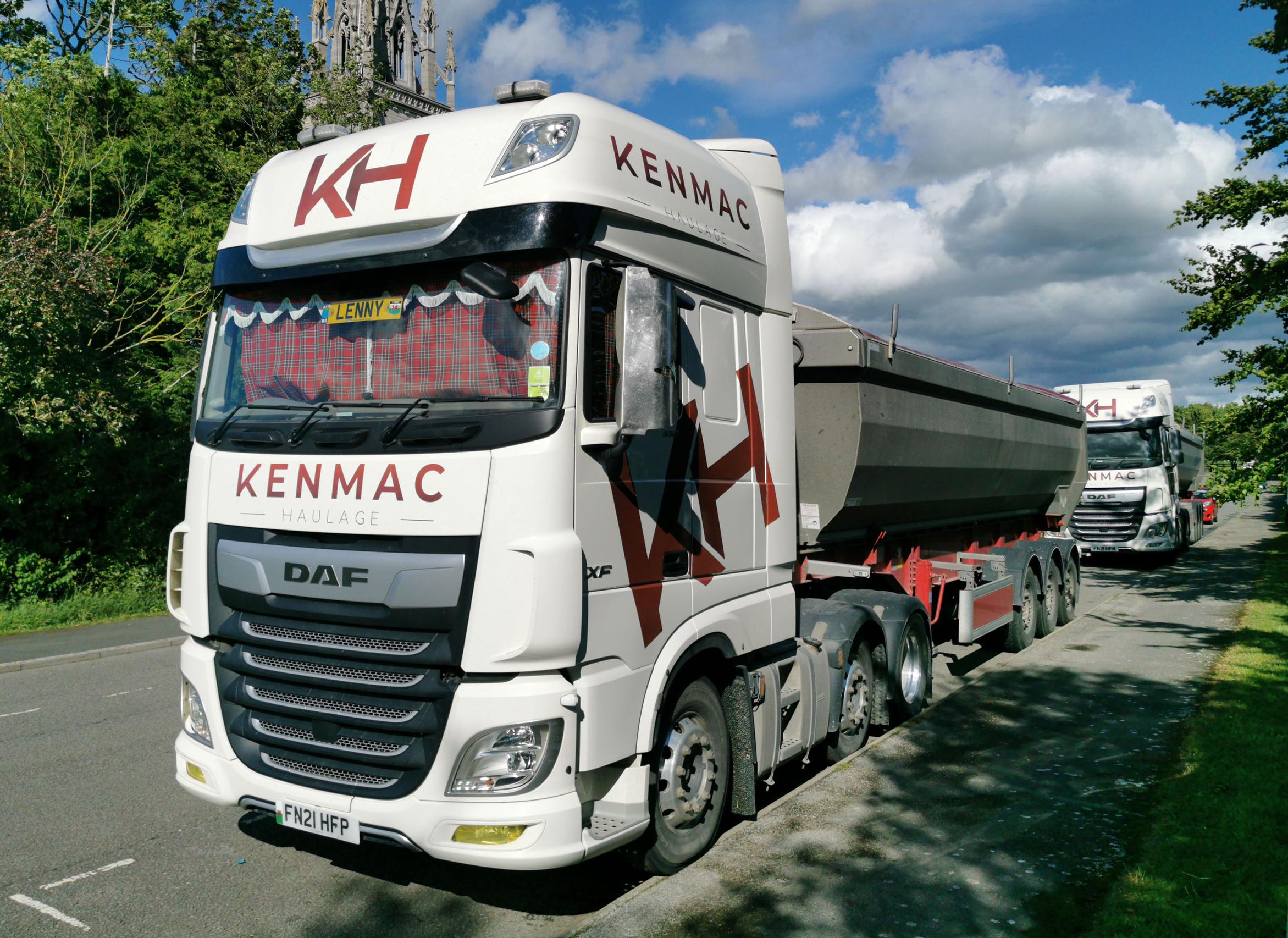 Inadequate rest areas for freight drivers result in HGVs parking on roadsides and in lay-bys. The nearside front wheels of these vehicles, parked near the A55 in North Wales, are resting on kerbstones to make the beds inside the cabs level.