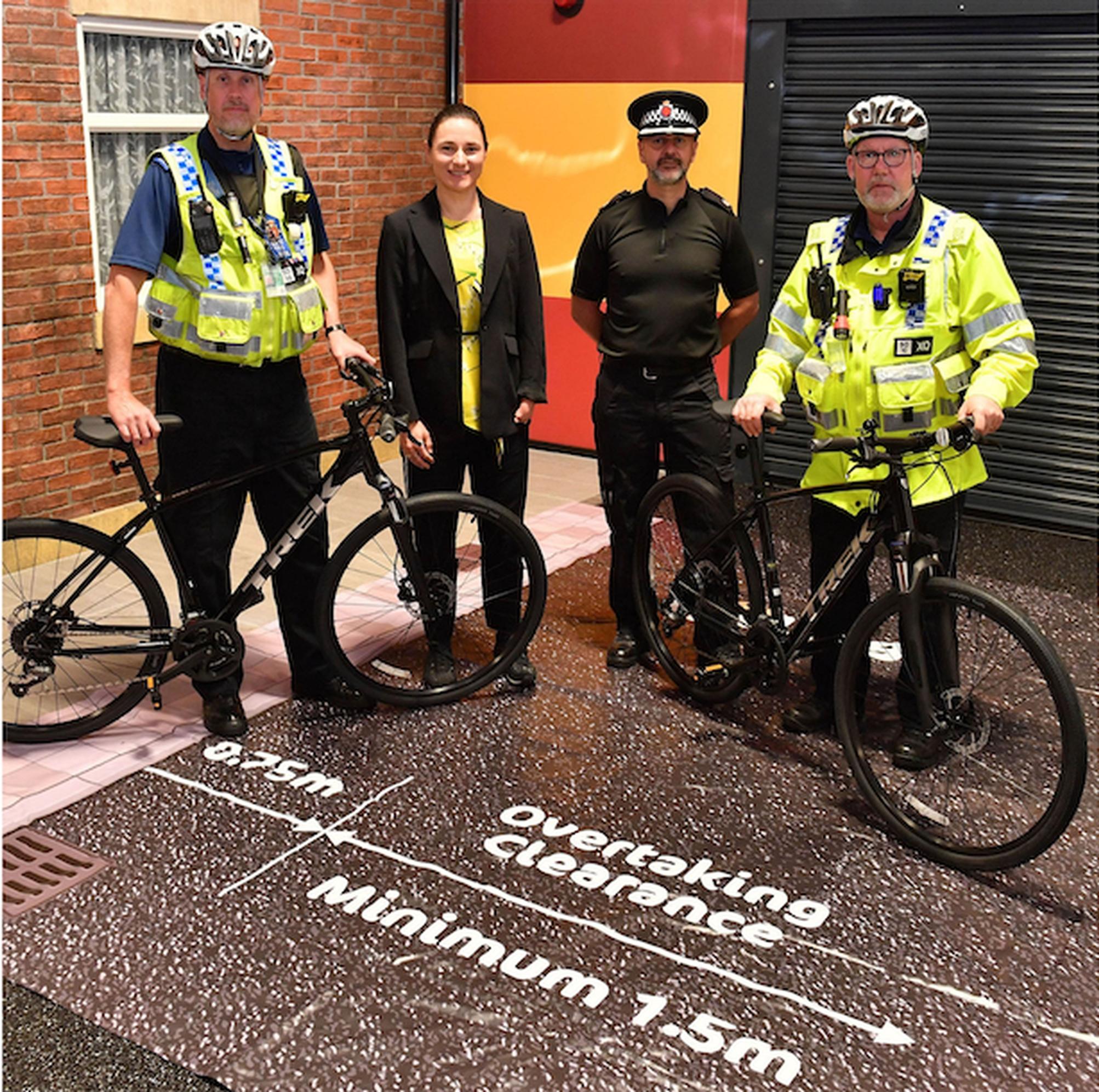 Dame Sarah Storey with GMP Superintendent Gareth Parkin and cycling officers at the re-launch of the Close Pass operation