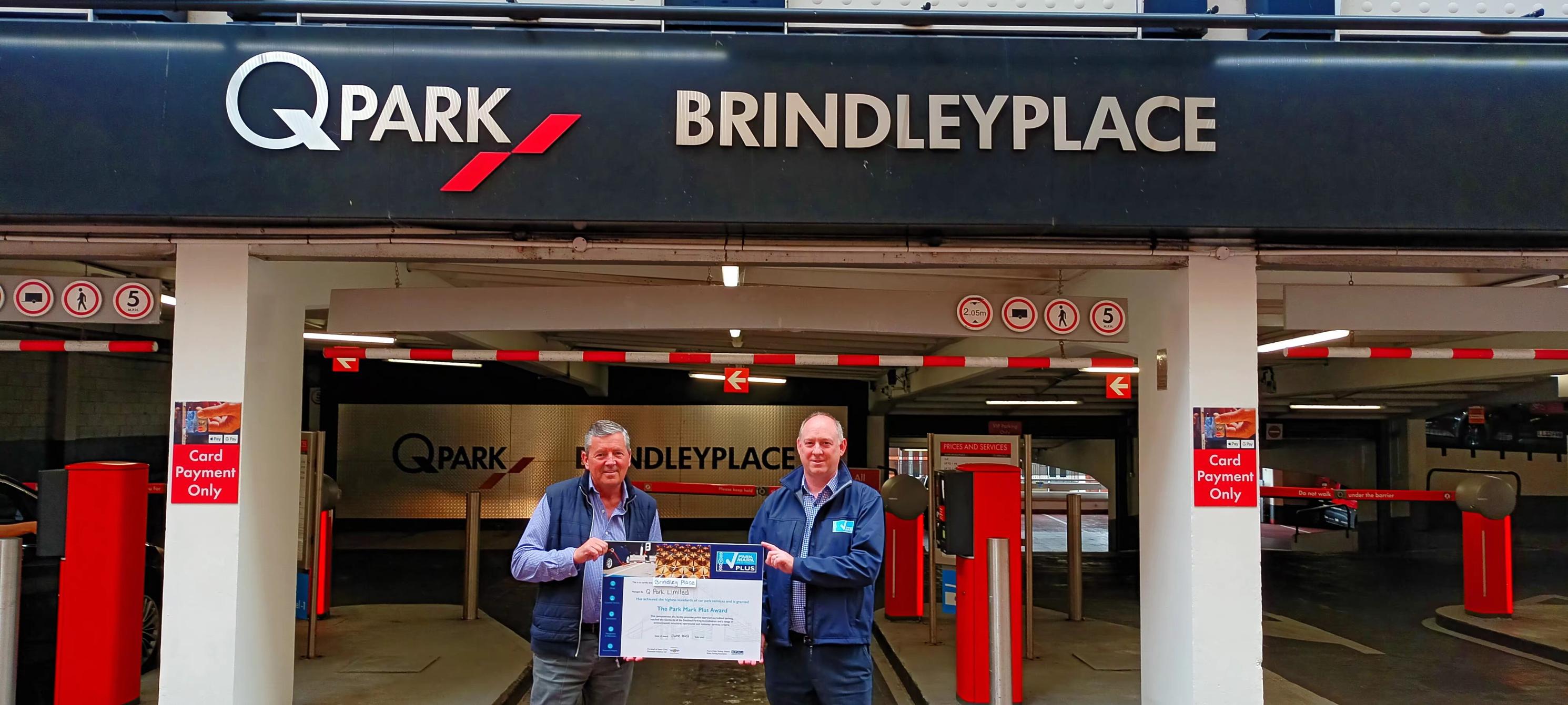 Matt Robinson, BPA area manager, presents Q-Park Brindley Place with Q-Park Plus