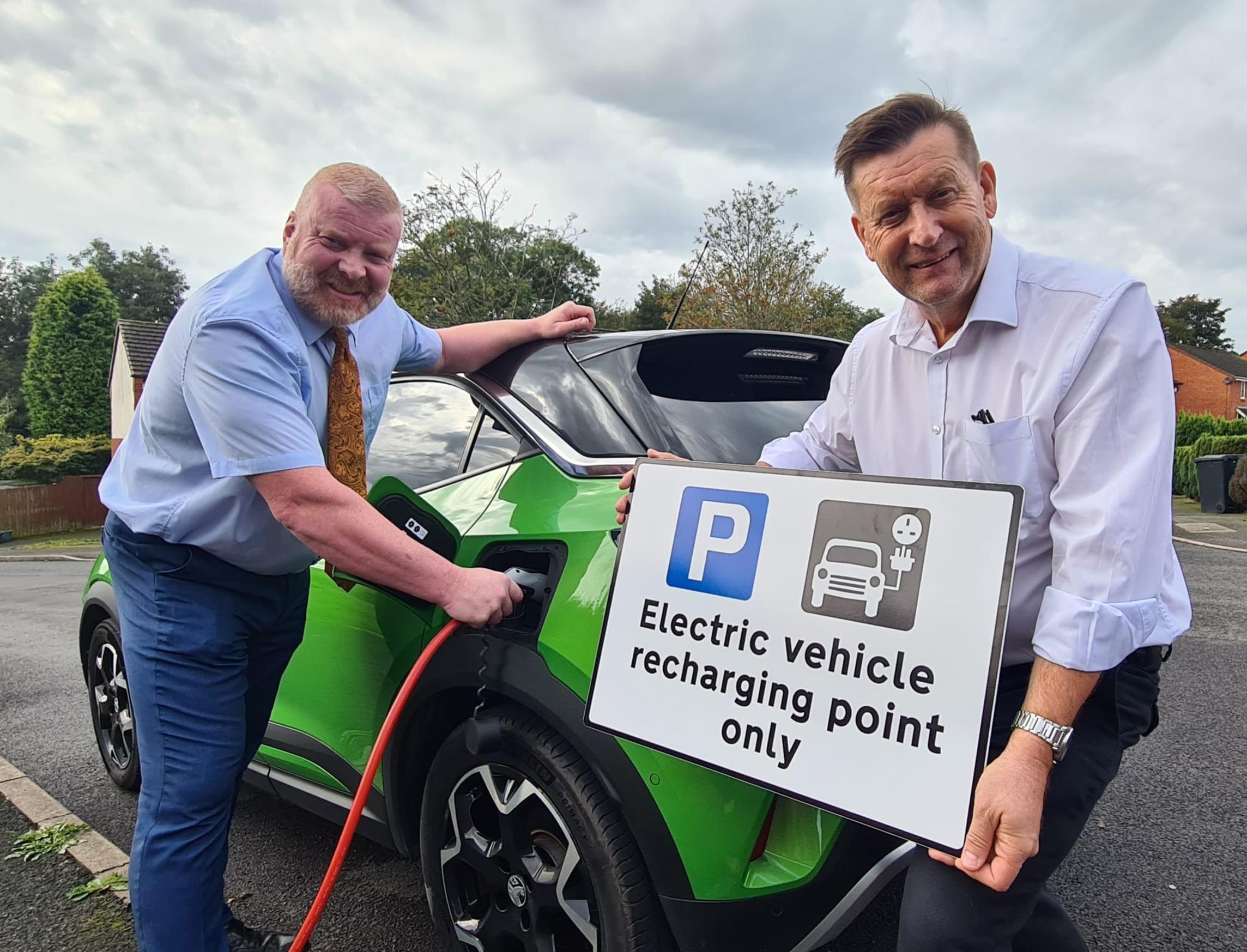 Cllr Damian Corfield and Cllr Dr Rob Clinton promoting EV charging