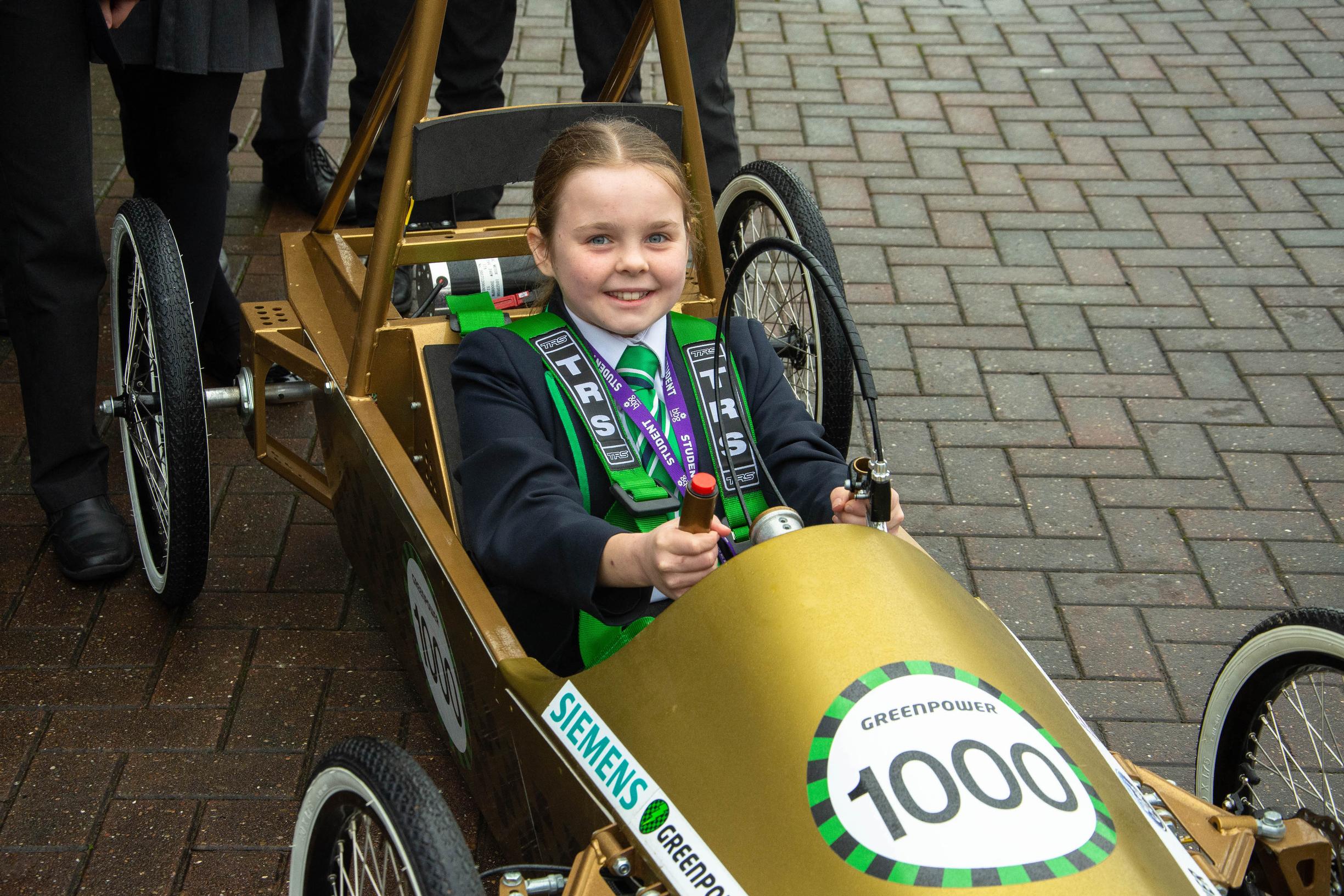 A pupil tests out a kit car