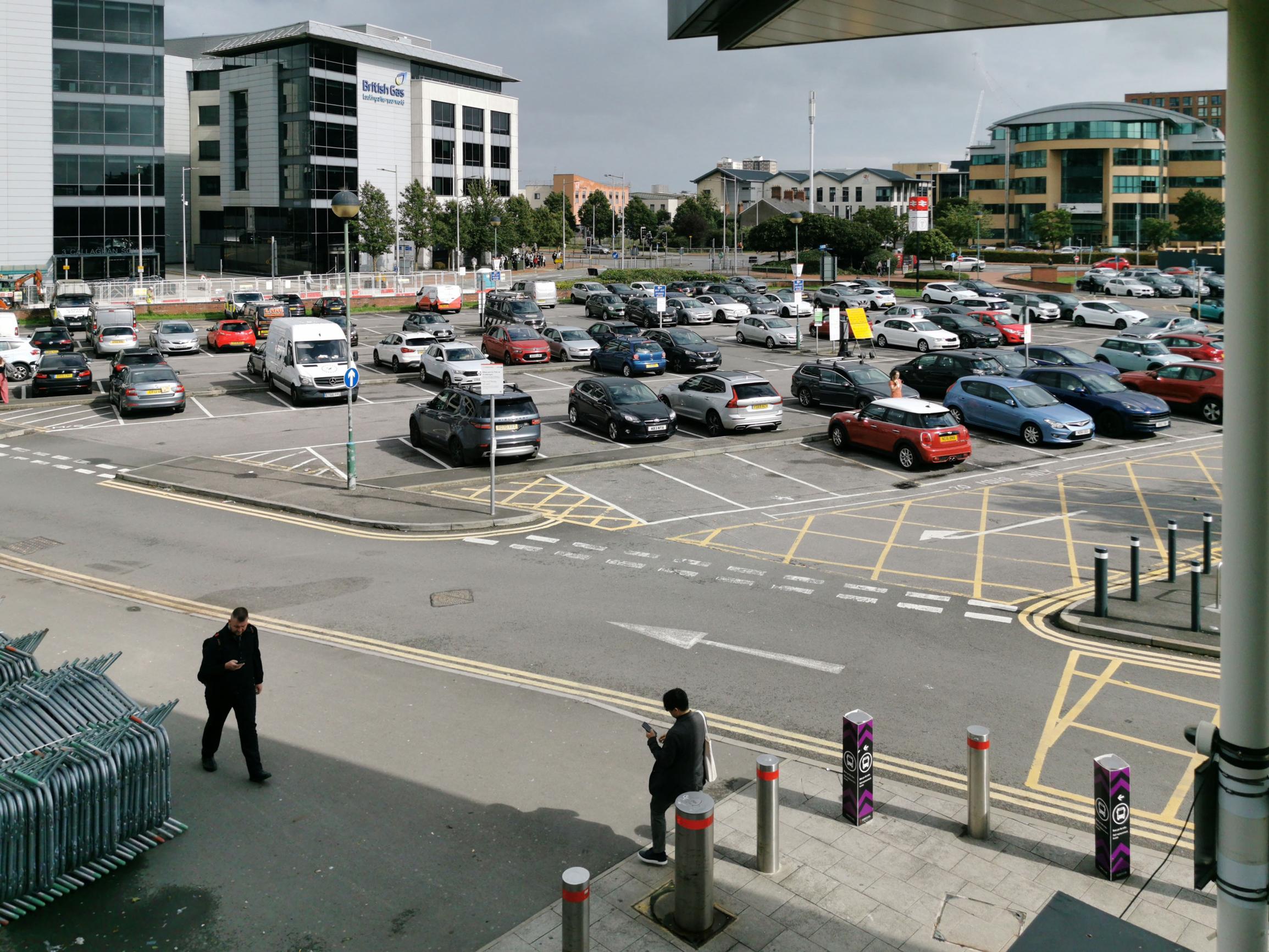 The car park south of Cardiff Central, with the station entrance off to the right. This area and Callaghan Square, beyond the offices on the left, will be remodelled when the tram tracks are installed
