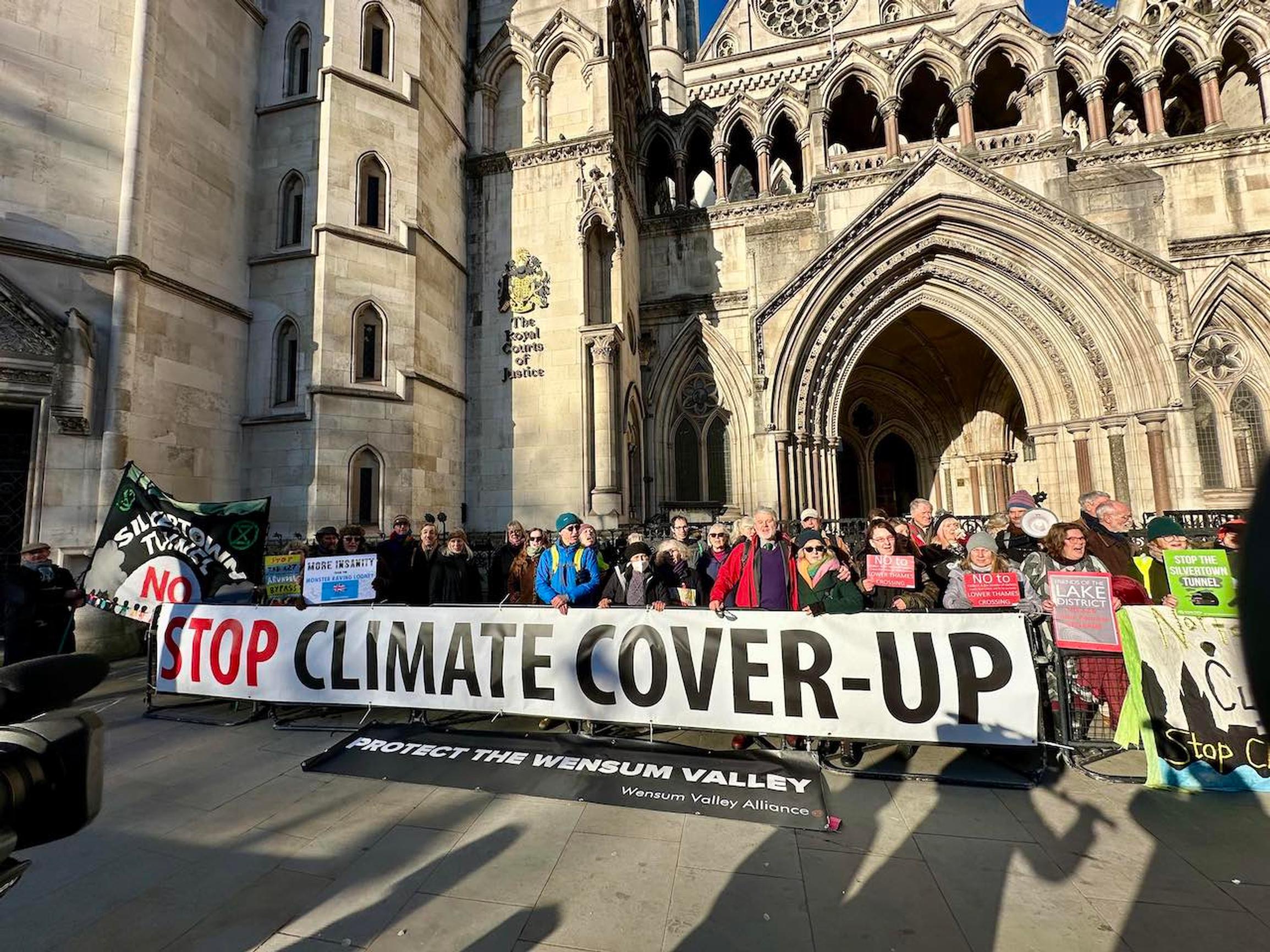 Dr Andrew Boswell and supporters outside the High Court after hisc hallenge against three road schemes on the A47