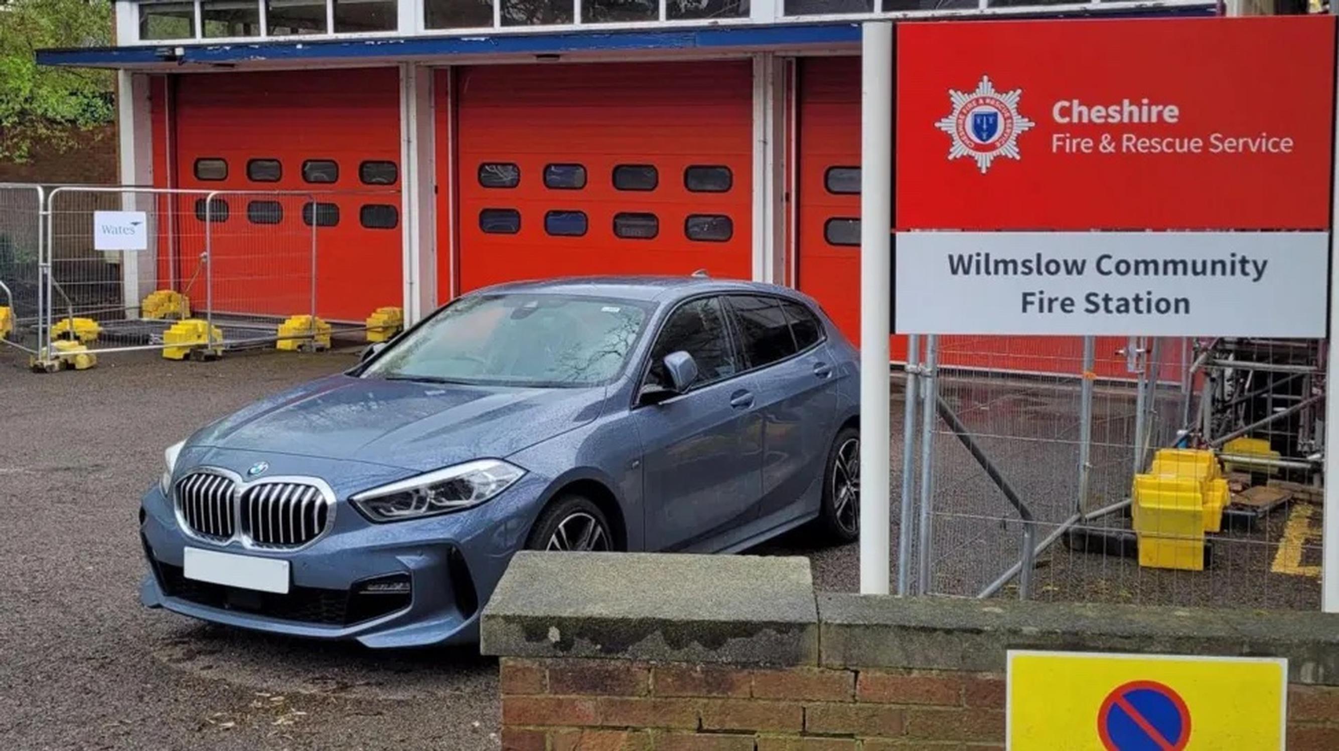 A car blocking a fire station