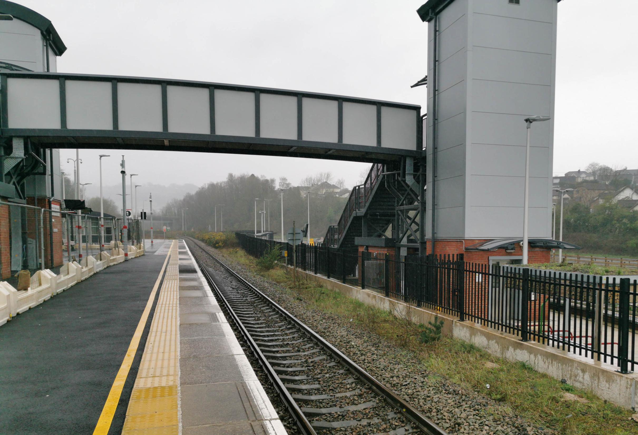 The new cycle parking stands at Pontypool & New Inn interchange are visible beyond the fence on the right, and the new bus shelter further along. The footbridge with lifts will be accessible to car users when it opens