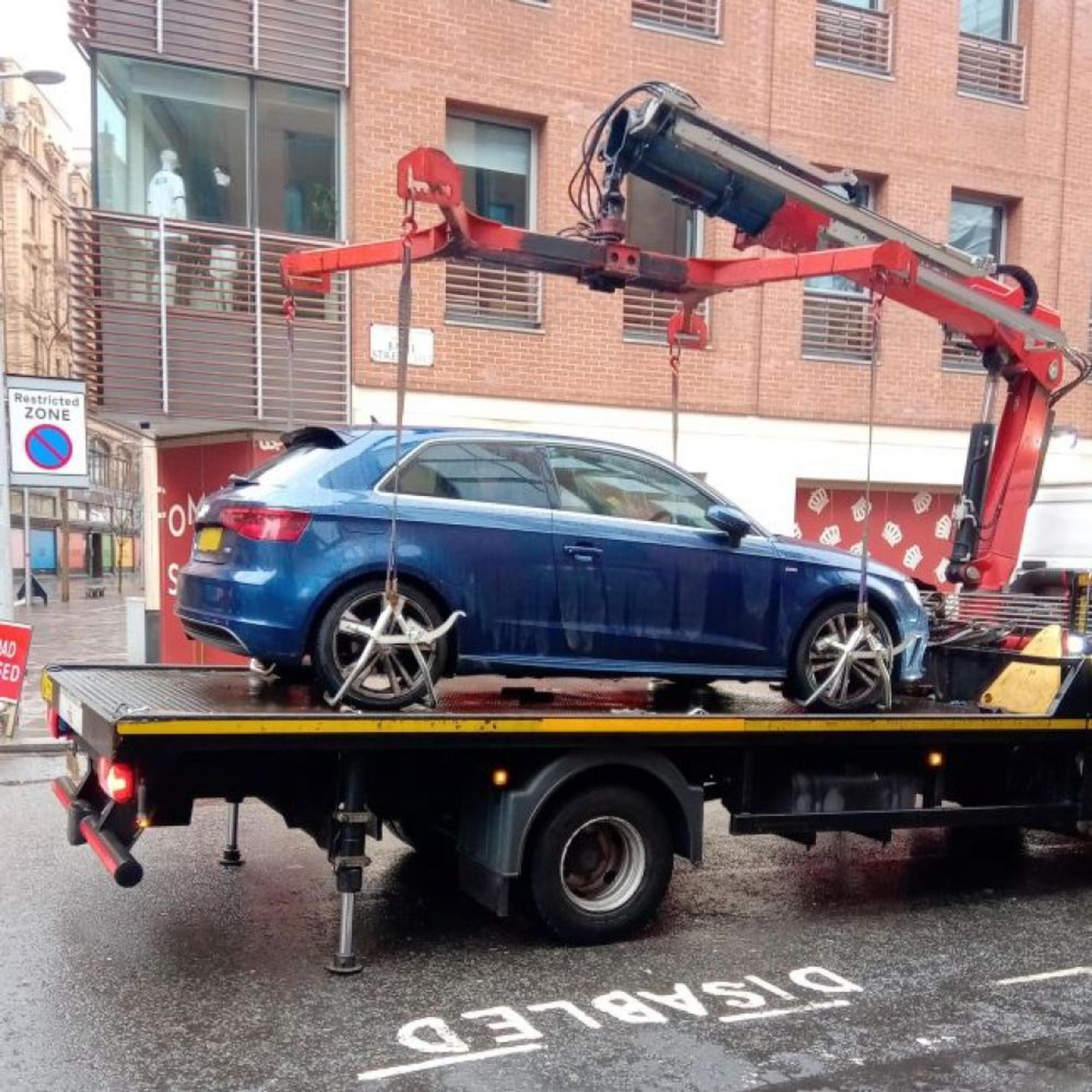 A vehicle suspected of wrongly displaying a Blue Badge being removed in Enfield (BBFi)