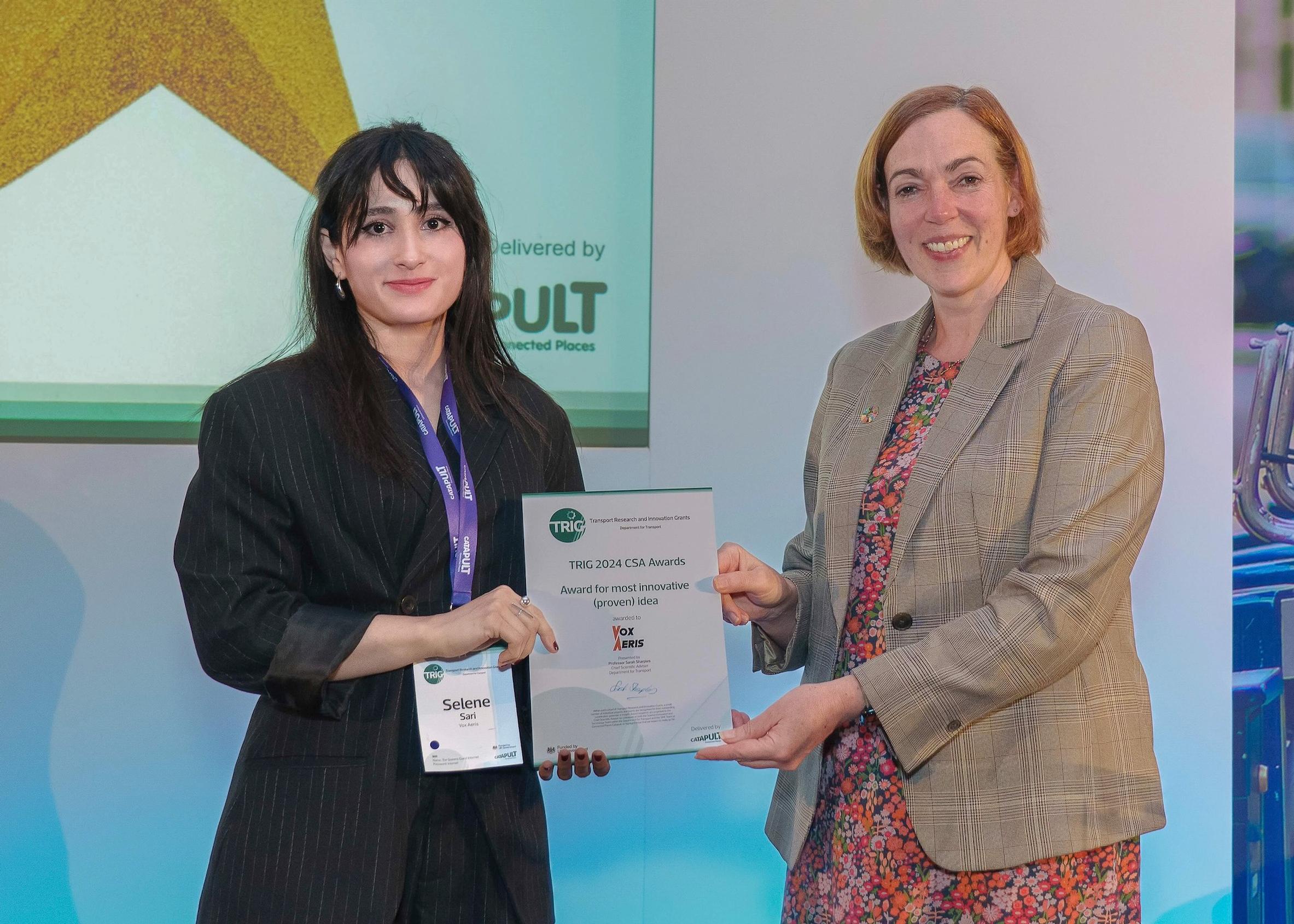 Selene Sari (left) is presented with DfT’s Chief Scientific Adviser’s Most Innovative Idea award by Professor Sarah Sharples
